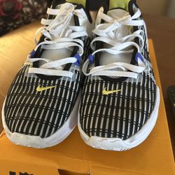 Black and white Nike LeBron shoes with yellow