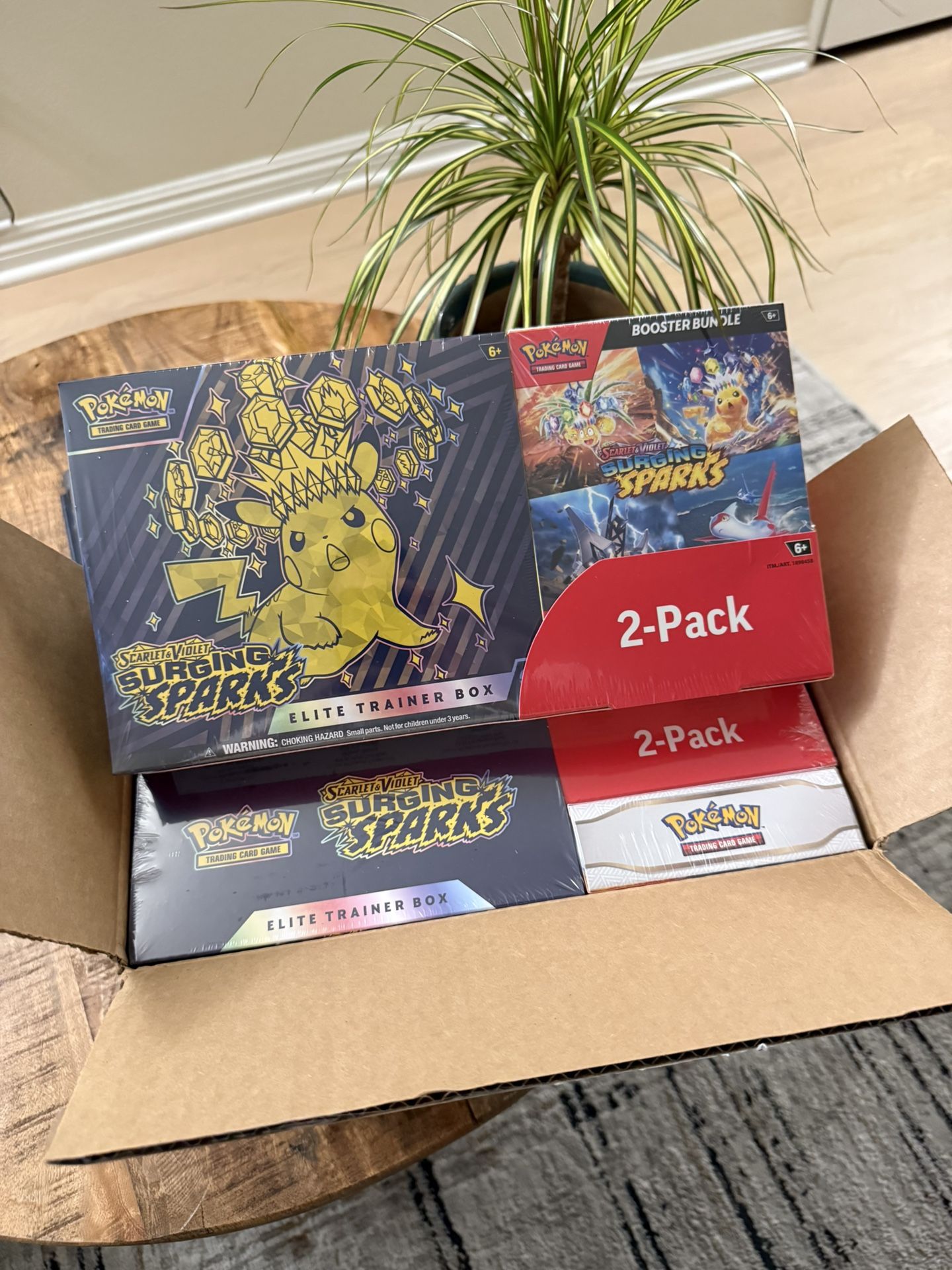 Surging Sparks ETB + Booster Bundle