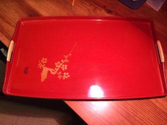 Vintage serving tray from Japan. Red with gold design. Black on the bottom.