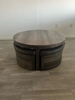 Cocktail table with 4 stools with storage on casters