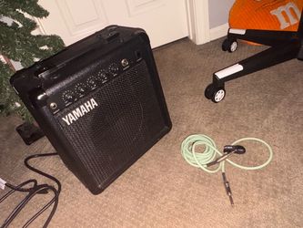 Yamaha amp barley used basically new , with 10 foot guitar cord