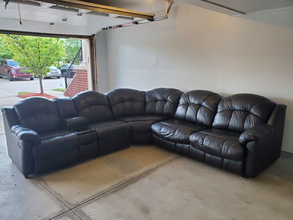 Genuine leather black sectional sofa with two recliners and sofa bed