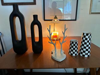 Decorative vases and metal antlers wall mount