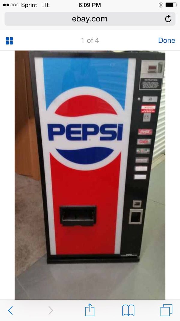 Cold pop machine set at .75 coins only nice size around 6ft by 3ft 350