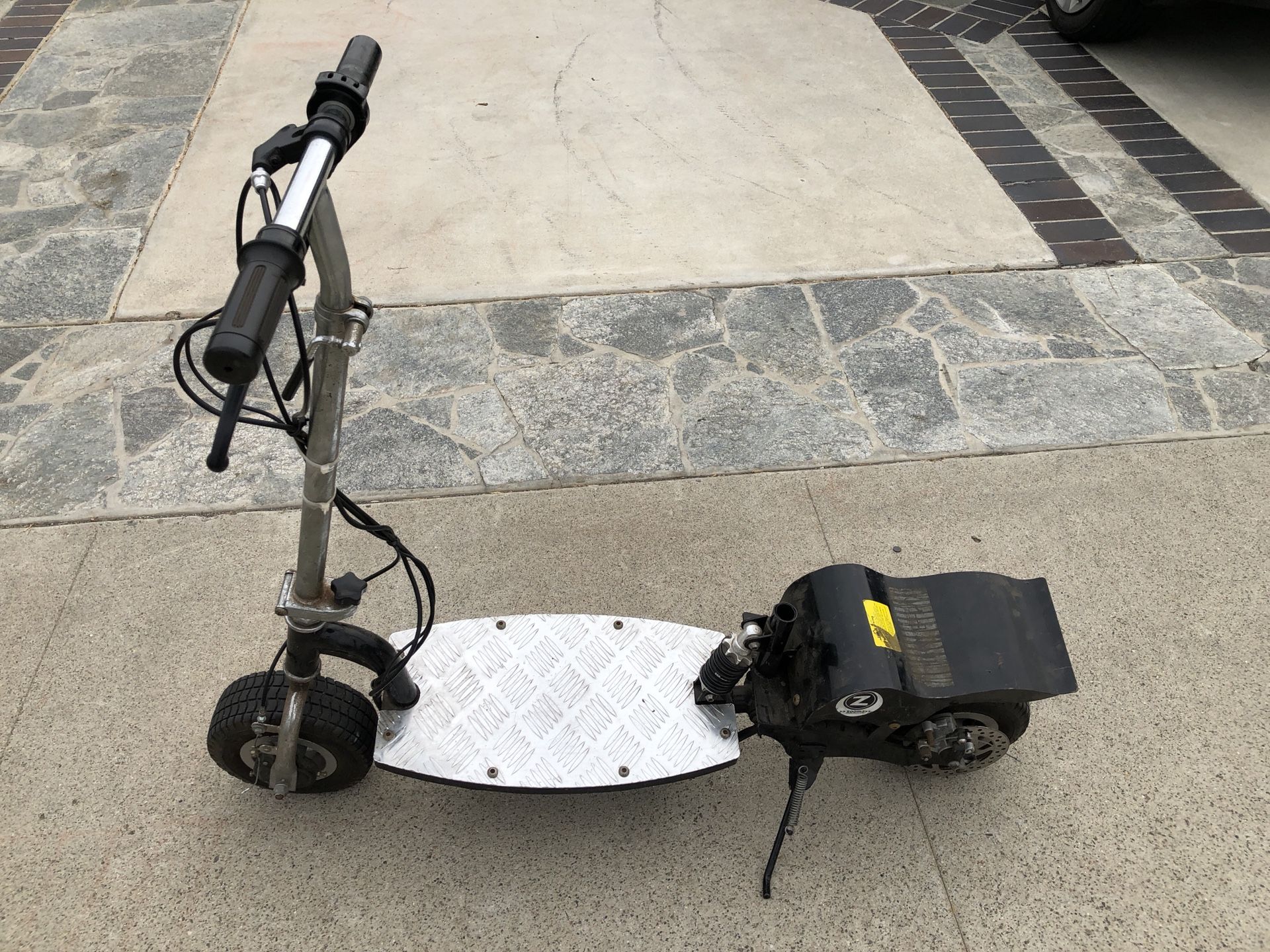 Zooma electric scooter $110 with batteries, $60 without. Firm price!
