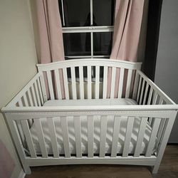Baby crib including mattress