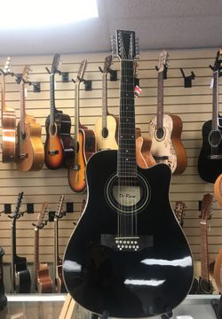 12 STRING DE ROSA ACOUSTIC/ELECTRIC GUITAR.(COMES IN BLACK,NATURAL,RED, BLUE, AND SUNBURST) COMES IN LEFTY TO.