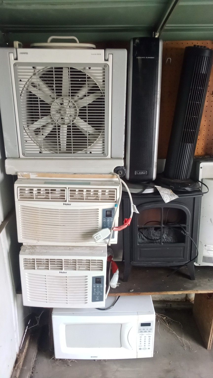 2 AC's Swamp Cooler A Two Tall Standing Fans In A Microwave