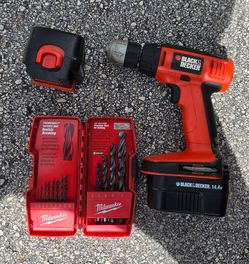 Black and Decker Drill with bits 2 batteries missing plug.