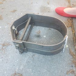 Pair of clevis silver metal pipe hangers