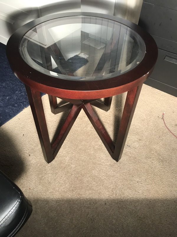 Round brown wooden frame glass top coffee table