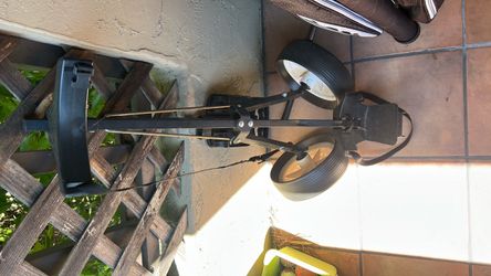 full golf setup: an Academy Sports golf bag (Fusion brand cover) with a mixed set of clubs (Alien driver/hybrid, Xcel II irons, various putters), plus