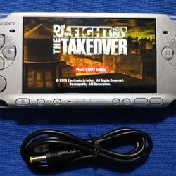 PSP 3000 With Charger And Games Inside. Works 