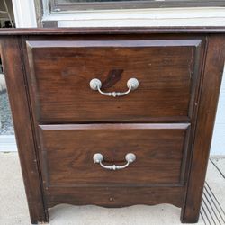 Sturdy solid wood 2-drawer nightstand in a dark walnut-style finish.  