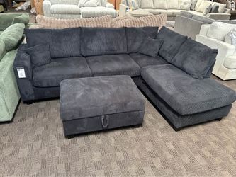 Black comfy sectional w/ storage ottoman