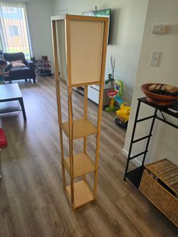 Standing lamp with shelves