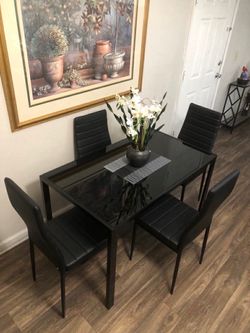 Black Glass dining table set with 4 leather chairs