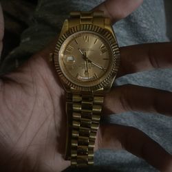 Gold Day Date Rolex Watch
