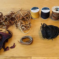 Yards of Leather Lacing Plus Rolls of Deer Skin Plus Misc. Flat Leather Cuttings.