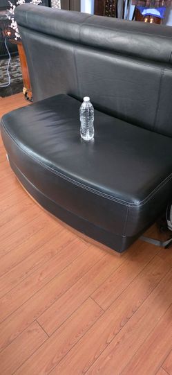 Real leather ottoman.