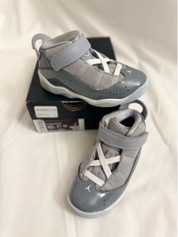 Jordan 6 Rings Toddler shoes in a Cool Grey and white colorway featuring a hook-and-loop strap