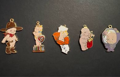 VINTAGE LOT OF 1980’s KEWPIE ENAMEL DOLL CHARMS
