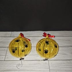 Christmas Holiday Decorative Yellow Plastic Tree Ornaments With Dog Paw Prints