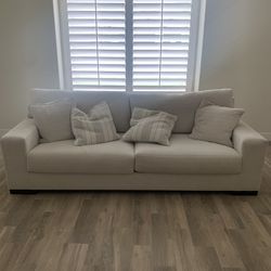 Sofa, chairs, bar stools and art frames