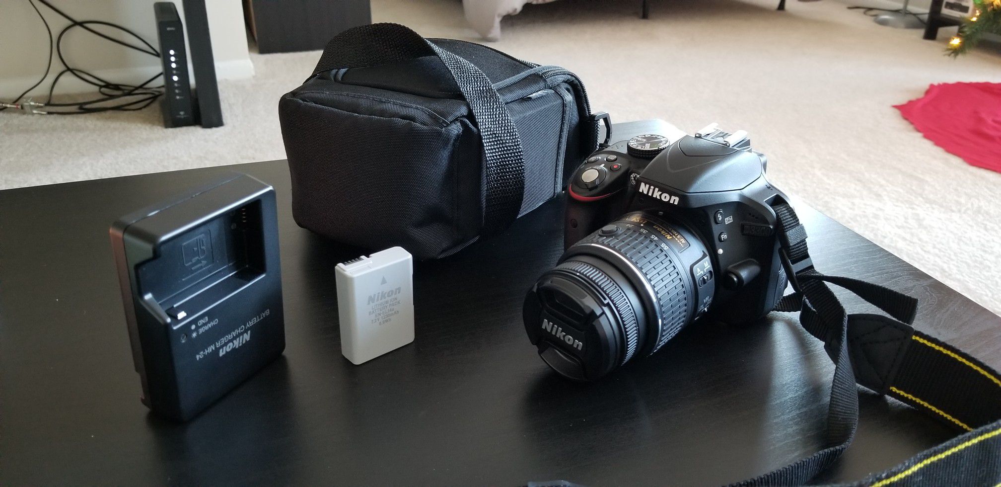 Nikon D3300 with 18-55mm lens, battery and battery charger