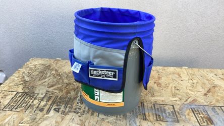 Tool bucket with 24 pouches for different types of tools.
