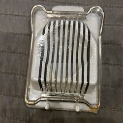 New Egg Slicer (with Slighty Rusty Hinges).  May clean right off once opened.