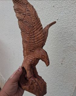 hand-carved wooden eagle sculpture