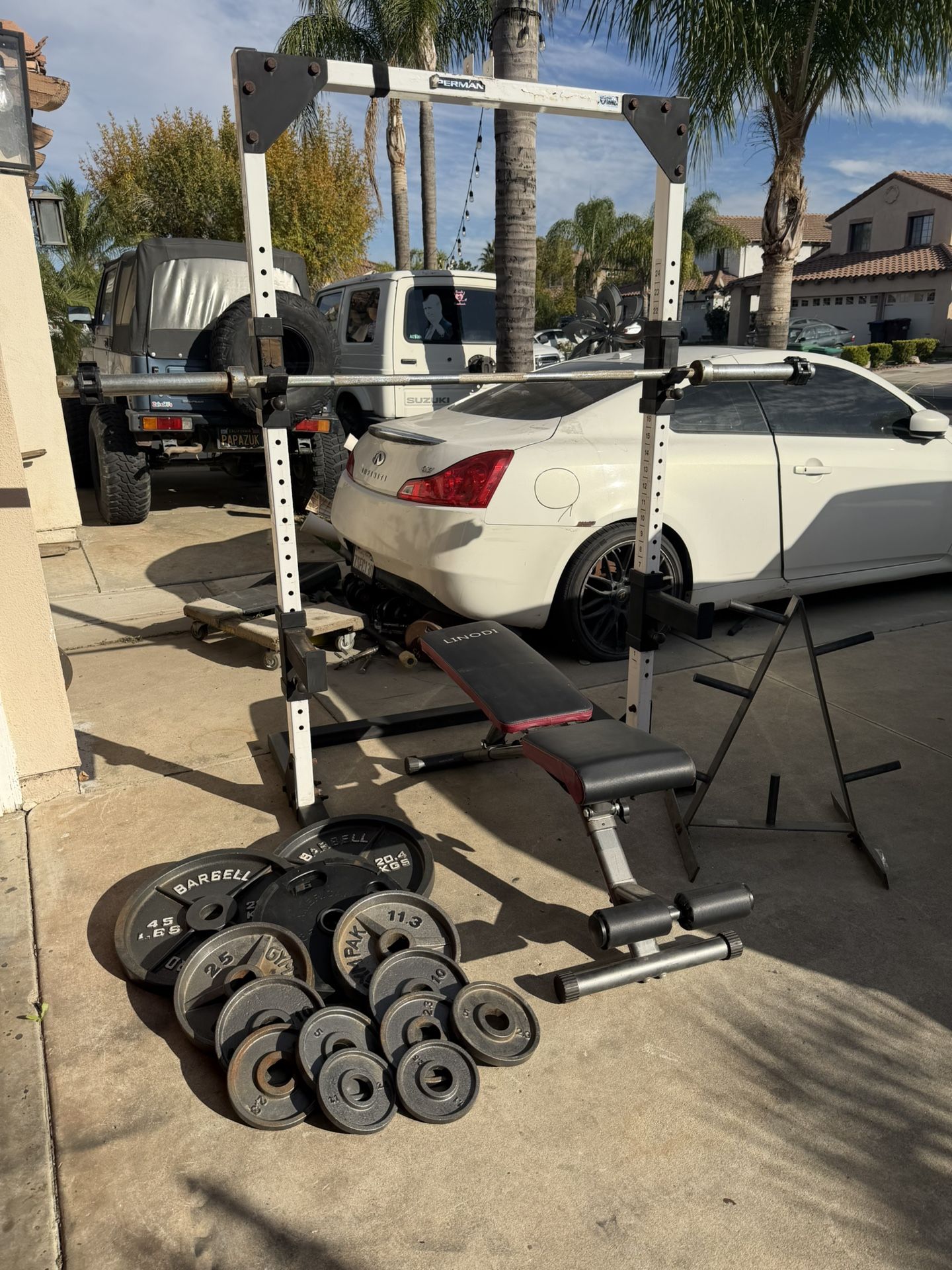 Heavy Duty Bench press/squat rack with 220lbs of Olympic weights and 7ft bar and weights tree