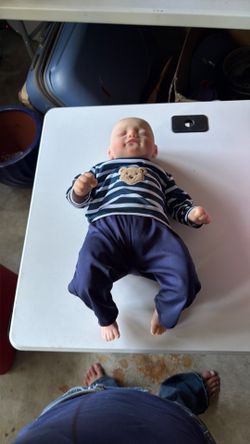 Realistic, baby doll that is a boy
