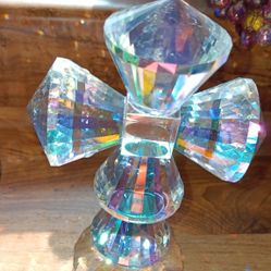 Vintage from the 1950s
Vintage signed Oleg Cassini crystal cut glass cross that acts as a prism and throws rainbows all over your room.