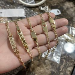 baby bracelets.  gold plated