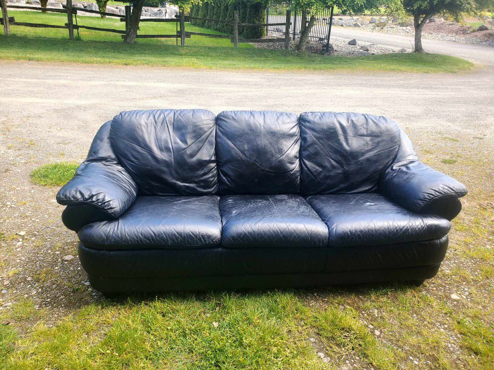 Leather couch
33" tall x 74" long x 32" deep
Low profile
Cushions are not removable
Minor wear in leather, overall great condition