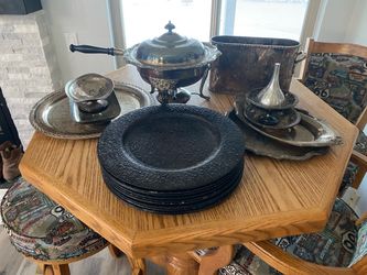 Silver serving plates, app warmer, wine holder and leather tooled plate servers