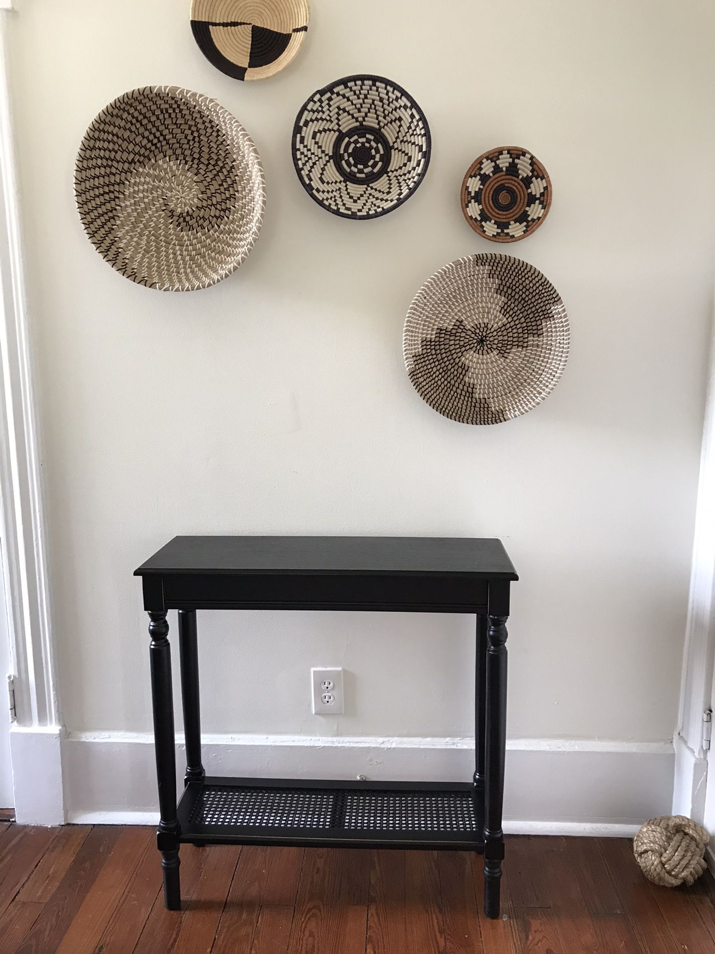 Black caned console table