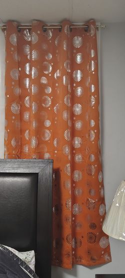 Brand new curtains with golden rods
