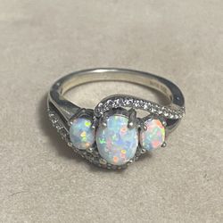 Vintage fire opal ring in fine retro ring, sterling silver number 925, size 61/2 asking $45, firm price.