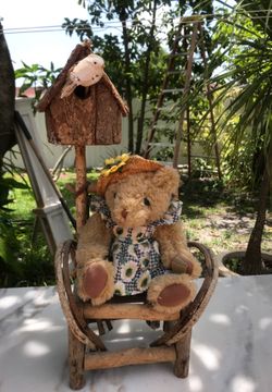 Grandmother teddy Bear sitting in wooding shear