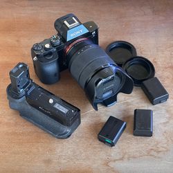 Sony A7 with 28-70mm lens, 5 batteries, & battery grip