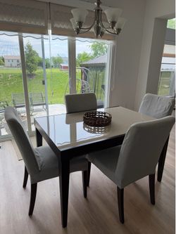 4 chairs and extendable glass dining table