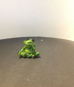 Small frog sucking it's fingers