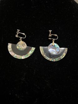 vintage fan-shaped earrings are crafted from Alpaca silver and feature iridescent abalone shell inlay