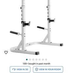 Squat Rack With Barbell And Weights. 