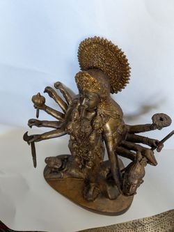 Hindu goddesse Kali with multiple arms 14 inches. Brass o bronze
