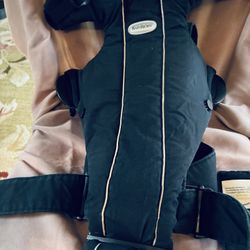Black BabyBjörn baby carrier in good condition.