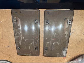Two license plate covers